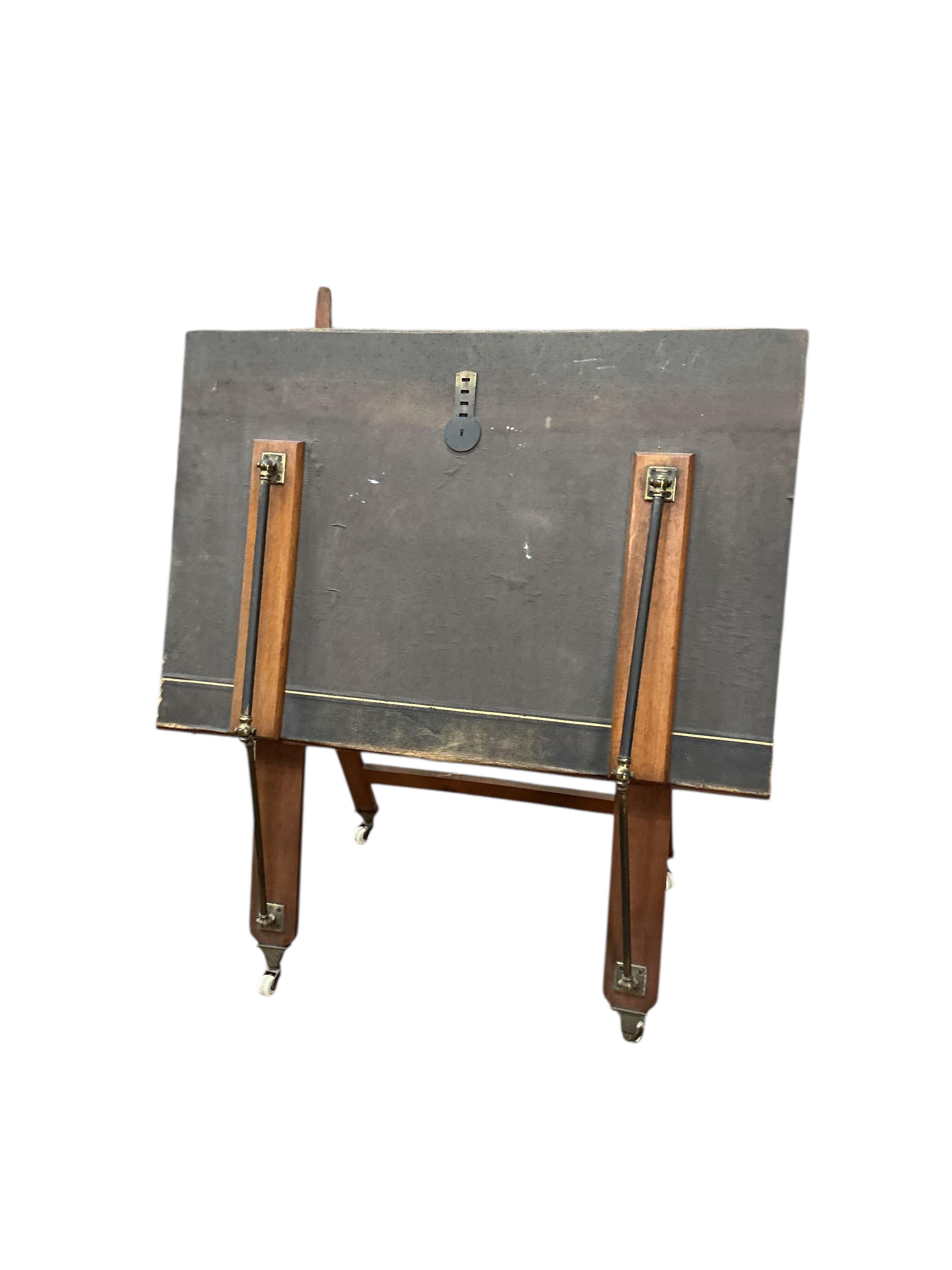 A Victorian brass mounted oak and leather portfolio stand, width 92cm, height 111cm